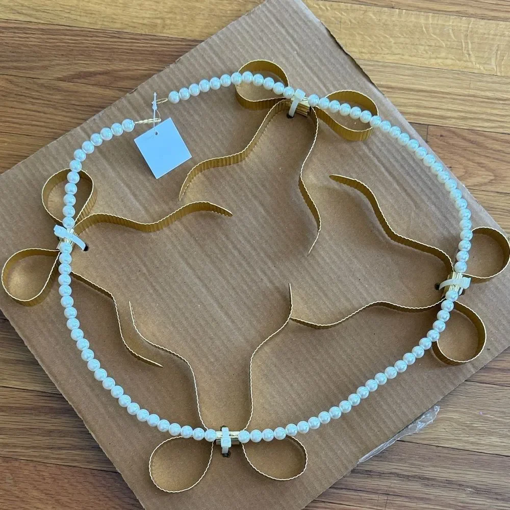 Eloise Pearl & Bow Banner from Urban Outfitters Outfit Your Dorm Back to School